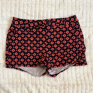 Navy blue and orange shorts.